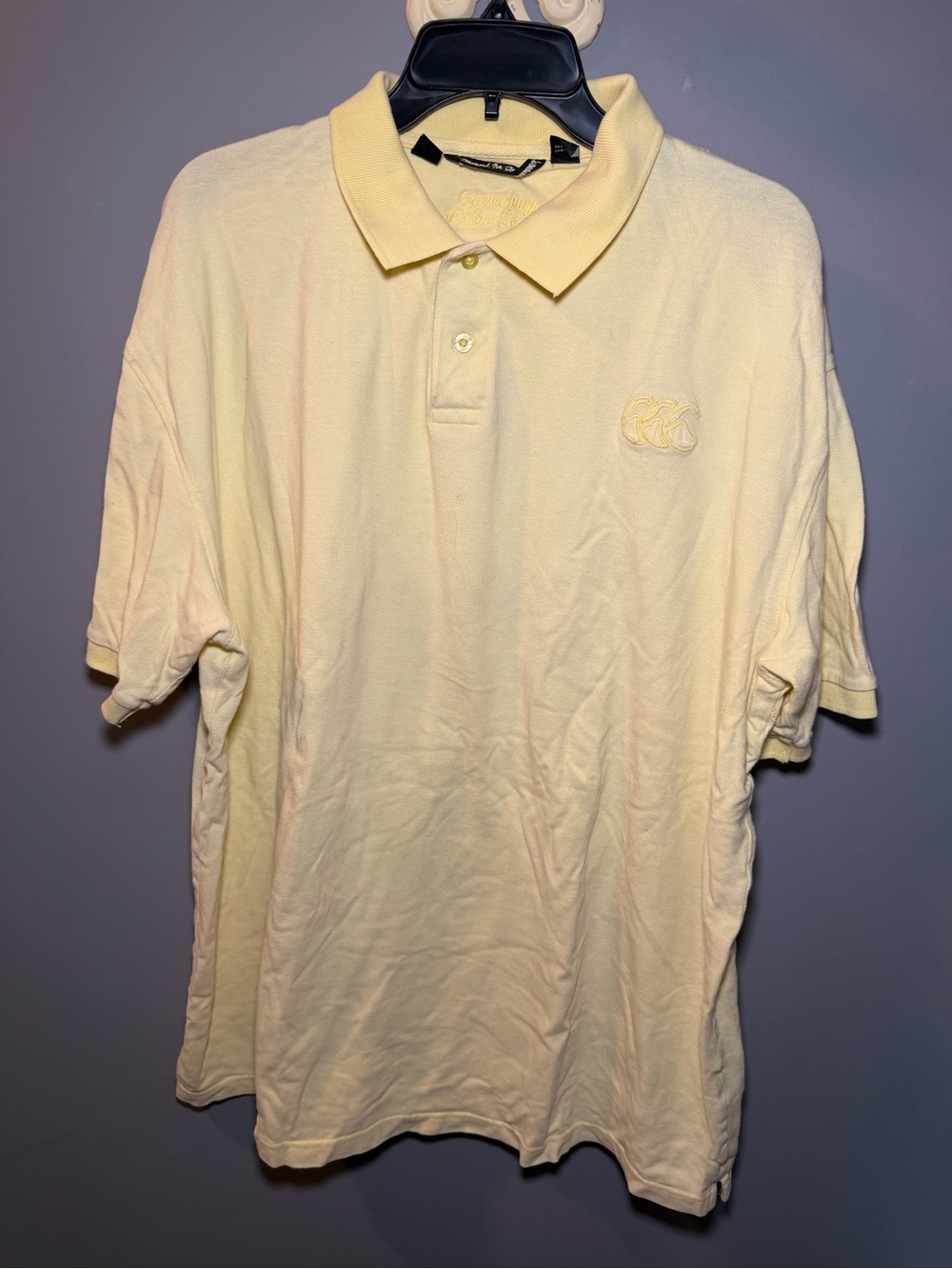 Men's Pale Yellow Polo Shirt with Subtle Chest Motif